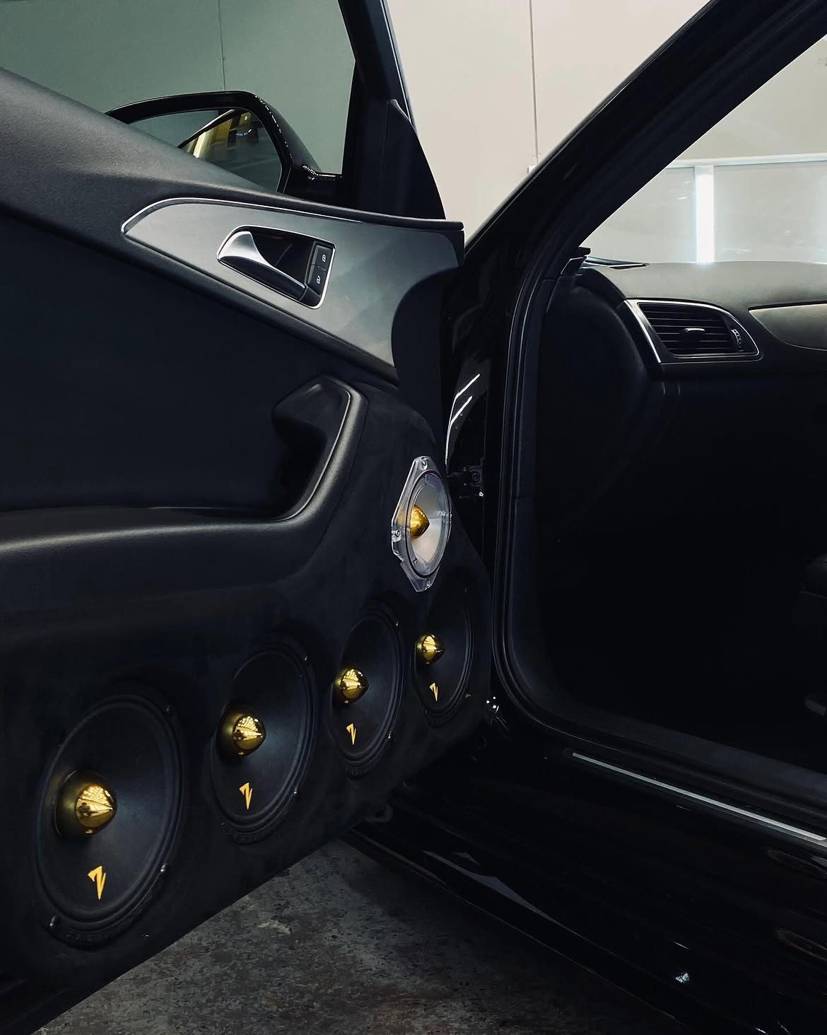 Custom gold audio build in an Audi door