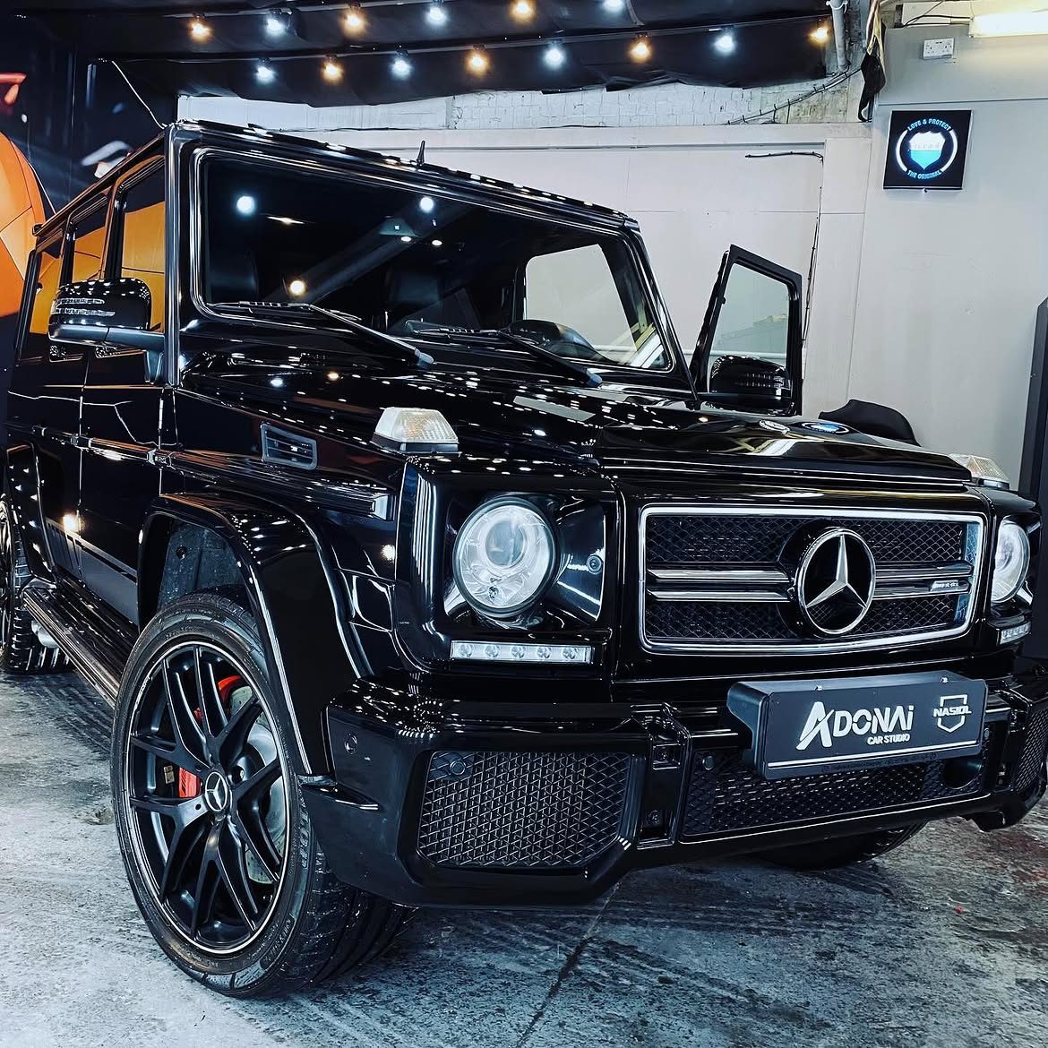 Black G-Wagon three-quarter view showing swirl-free corrected paint